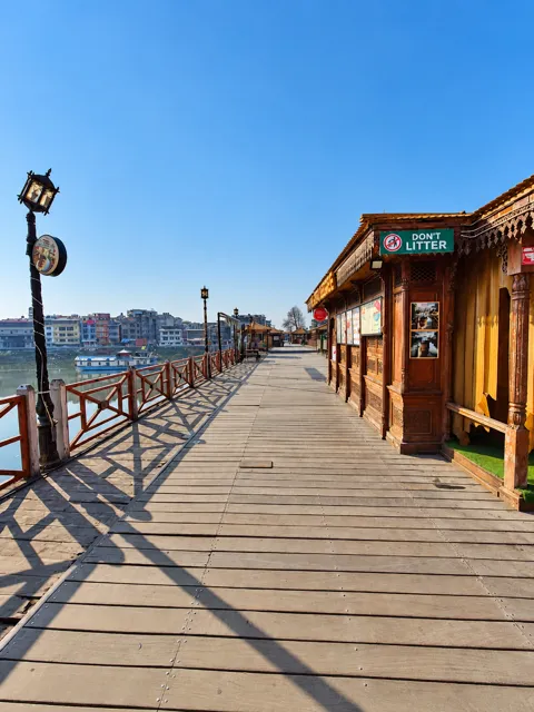 Wooden waterfront walkway in sunlight