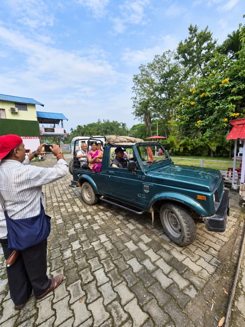 Travellers enjoying an open-top jeep ride
