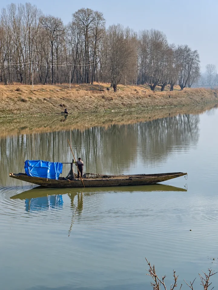A wooden boat on a peaceful river
